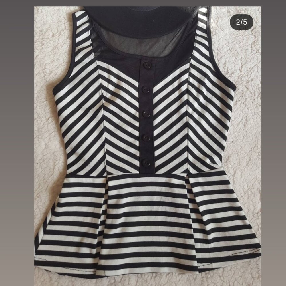 Pretty black and white peplum top.